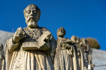Stone statue representing several saints, with emphasis on Saint Stephen, belonging to the episcopal garden of the city of Castelo Branco-Portugal.