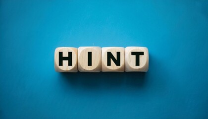 木製の正方形のhintの英単語が入ったブロックキューブ。aiで生成