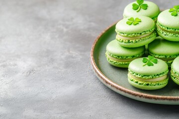 Delightful green macarons arranged on a rustic plate with charming shamrock decorations