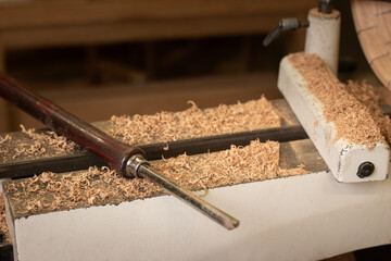 Natural wood sawdust background. Waste wood processing in the workshop