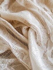 Delicate beige lace fabric with intricate pattern and texture