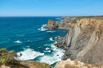 Stunning sheer and steep cliffs above the Atlantic Ocean in Arrifana