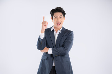 Portrait of young Asian business man posing on white background