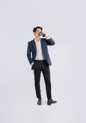 Full body image of a young Asian business man posing on a white backgrounded Image