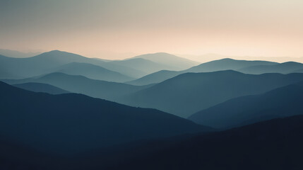 Obraz premium Serene Mountain Panorama: A breathtaking panoramic view of a mountain range bathed in the soft glow of dawn, with layers of misty peaks receding into the distance.