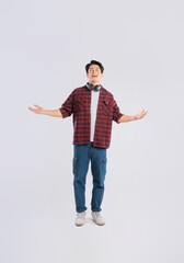 Full body image of young dynamic Asian man posing on white backgroundmage