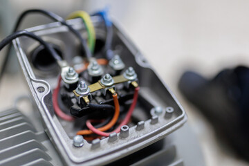 electrical cables connecting with terminal of motor in cover box of Power induction motor pump.Motor Terminal Box ..