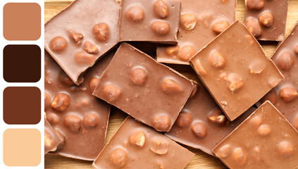 Sweet tasty chocolate with nuts as background
