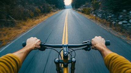 First-person view of a person cycling down a scenic road.