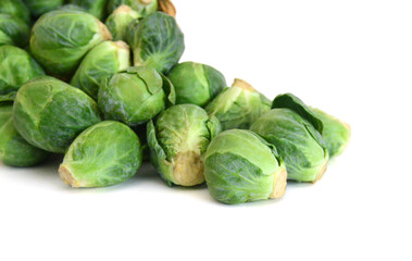 Fototapeta premium Apile of Brussels sprouts on a white background