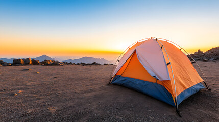 vibrant sunrise viewed from mountain camp with orange tent. serene landscape evokes sense of adventure and tranquility