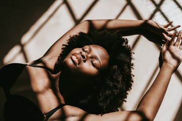 Shadows over a sensual black woman