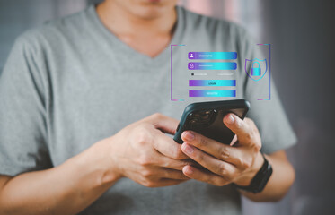 A person in a gray shirt uses a smartphone, with digital elements displayed on the screen, suggesting interaction with technology.