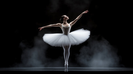 Obraz premium Ballet Elegance: A graceful ballerina, clad in a billowing white tutu, performs with ethereal beauty against a backdrop of swirling mist. The image captures the essence of classical dance.