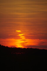 Deep orange sunset with clouds