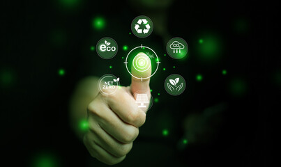 Green energy concept. A man with his thumbs up at icons of sustainable renewable power sources