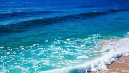 Fototapeta premium Turquoise waves crashing on a tropical beach under a clear blue sky with sandy shores and a beautiful ocean horizon