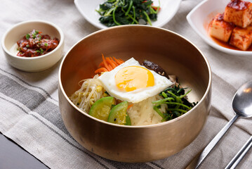 Bibimbap with vegetables, mushrooms, and half-boiled eggs