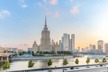 High-rise stalinist building near river at summer sunset in Moscow, Russia. Historic name is Hotel Ukraine.