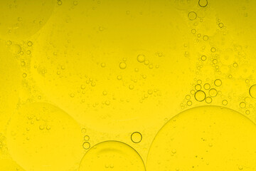 Macro microscope yellow bubble texture, Close-up Yellow bubbles and drops oil background . golden Yellow water bubbles, close up golden oil drop for celebration