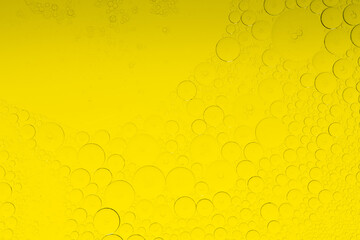 Macro microscope yellow bubble texture, Close-up Yellow bubbles and drops oil background . golden...