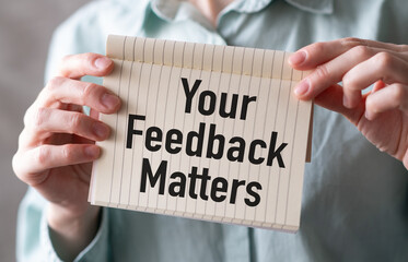 Top view image white paper card written text your feedback matters with a pen.