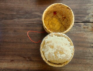 Authentic Thai sticky rice served in a handmade bamboo basket, highlighting traditional Thai dining culture and the simplicity of homemade Asian food.
