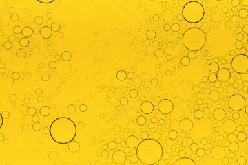 Macro microscope yellow bubble texture, Close-up Yellow bubbles and drops oil background . golden Yellow water bubbles, close up golden oil drop for celebration