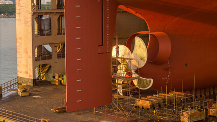 Propeller of large ship spinning power working and water splash contrail . Close up image detail Stern back of Vessel ship, Logistics Transportation industry express technology Freight. © Yellow Boat