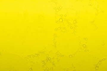 Macro microscope yellow bubble texture, Close-up Yellow bubbles and drops oil background . golden Yellow water bubbles, close up golden oil drop for celebration