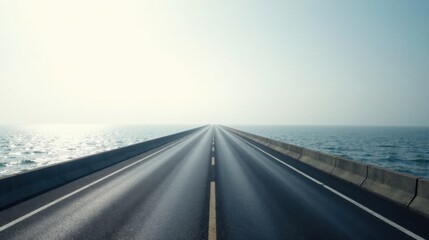 Fototapeta premium Asphalt road vanishing into hazy ocean horizon, a journey of open road and endless possibilities