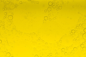 Macro microscope yellow bubble texture, Close-up Yellow bubbles and drops oil background . golden Yellow water bubbles, close up golden oil drop for celebration