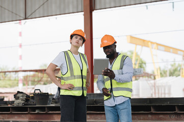 A group of engineers inspect the strength of the building and foundations, showing the...