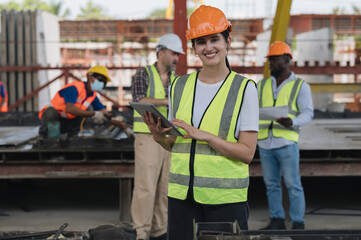 A group of engineers inspect the strength of the building and foundations, showing the construction. Workers at the construction site.