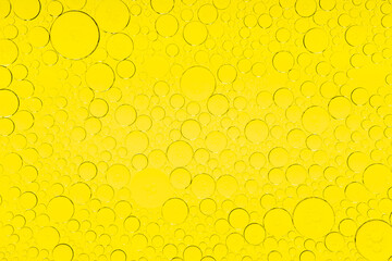 Macro microscope yellow bubble texture, Close-up Yellow bubbles and drops oil background . golden Yellow water bubbles, close up golden oil drop for celebration