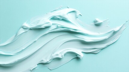 12.A dynamic view of a broad cosmetic cream smear with visible texture ridges on a vibrant aqua blue background, offering a modern and clean aesthetic.
