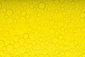 Macro microscope yellow bubble texture, Close-up Yellow bubbles and drops oil background . golden Yellow water bubbles, close up golden oil drop for celebration