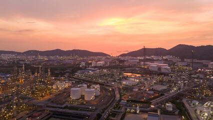 Oil Refinery plant at sunset. Gas Chemical Equipment Prodiction import export Concept, Crude Oil Refinery Plant Steel Pump Pipe line and Chimney and Cooling tower, Chemical Petrochemical