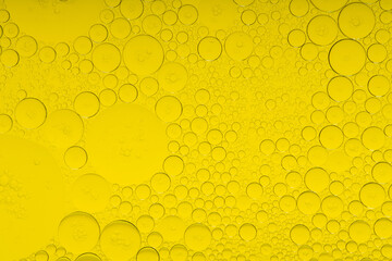 Macro microscope yellow bubble texture, Close-up Yellow bubbles and drops oil background . golden Yellow water bubbles, close up golden oil drop for celebration
