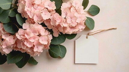 A serene bouquet of pink and white hydrangeas, ideal for weddings, anniversaries, or personal notes. Features a blank tag for customized messages.