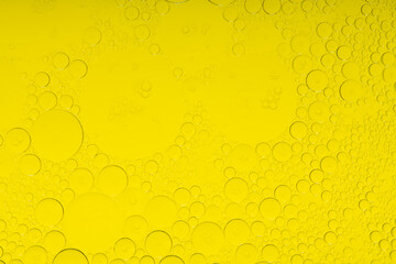 Macro microscope yellow bubble texture, Close-up Yellow bubbles and drops oil background . golden Yellow water bubbles, close up golden oil drop for celebration