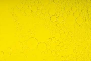 Macro microscope yellow bubble texture, Close-up Yellow bubbles and drops oil background . golden Yellow water bubbles, close up golden oil drop for celebration
