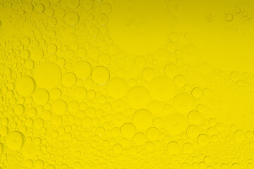 Macro microscope yellow bubble texture, Close-up Yellow bubbles and drops oil background . golden Yellow water bubbles, close up golden oil drop for celebration