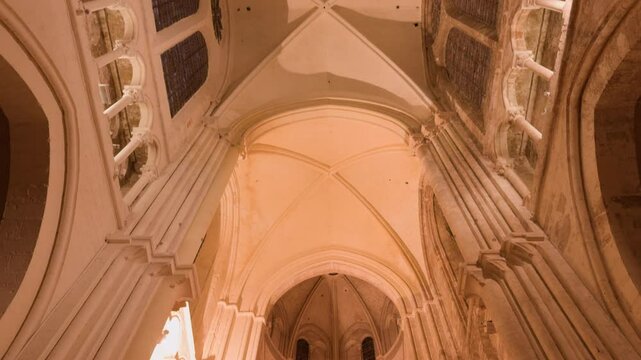 Tilt down view of painted ceiling of Saint-Nicolas Church with vintage old architecture in Blois, France. No people.
