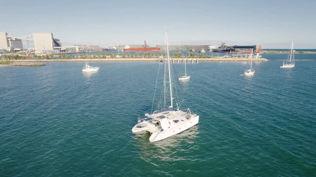 Yacht And Catamaran Boat Floating In The Sea At Geraldton In Western Australia. - aerial shot