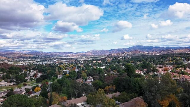 Santa Clarita, California below the mountain range in autumn - aerial hyper lapse
