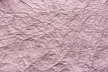 Texture of lilac crumpled paper, closeup