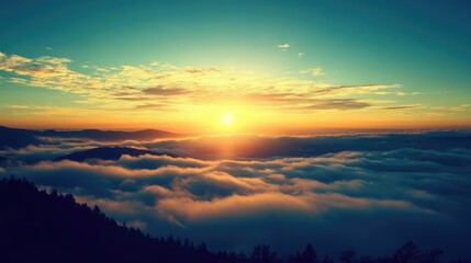 Fototapeta premium Serene sunrise over misty mountains with vibrant clouds and a tranquil sky creating a peaceful morning atmosphere.
