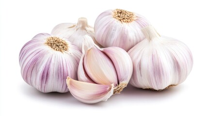 Fresh garlic bulbs and cloves displayed on a clean white background showcasing their vibrant texture and color for culinary imagery.