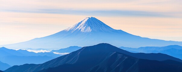 Fototapeta premium Simple mountain range concept. Majestic snow-capped mountain against a serene sky.